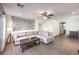Spacious living room with wood-look floors, neutral tones, and comfortable seating, perfect for relaxation at 7732 Canon Walk St, Las Vegas, NV 89139