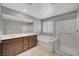 This bathroom features a double sink vanity, soaking tub, and glass shower enclosure at 7870 Formitch Ct, Las Vegas, NV 89166