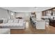 Comfortable living space featuring an open layout, a granite island, and wood style flooring at 7870 Formitch Ct, Las Vegas, NV 89166