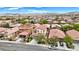 Aerial view of a residential neighborhood with neat landscaping and mountain views at 7941 Limestone Arch Ave, Las Vegas, NV 89178
