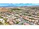 Expansive aerial view of a quiet neighborhood with beautiful homes and well-manicured streets at 7941 Limestone Arch Ave, Las Vegas, NV 89178