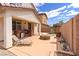 Inviting backyard featuring a built-in grill, lounge chair, and cozy stone fire pit at 7941 Limestone Arch Ave, Las Vegas, NV 89178