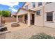 Backyard with a covered patio, desert landscaping, a fire pit, and a built-in grill at 7941 Limestone Arch Ave, Las Vegas, NV 89178