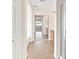 Bathroom hallway with ceramic tile, shower, tub, cabinets, and natural light at 7941 Limestone Arch Ave, Las Vegas, NV 89178