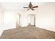 Bedroom featuring neutral carpet, white walls, and arched doorways for a bright, spacious feel at 7941 Limestone Arch Ave, Las Vegas, NV 89178