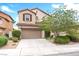 Charming two-story home with a well-manicured front yard and a two-car garage at 7941 Limestone Arch Ave, Las Vegas, NV 89178