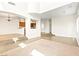 Bright, open living room with high ceilings, neutral decor, and multi-level floor at 7941 Limestone Arch Ave, Las Vegas, NV 89178