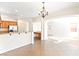 Open-concept living room with breakfast bar, archway to living space, and tile flooring at 7941 Limestone Arch Ave, Las Vegas, NV 89178