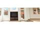 Spacious living room with built in media center, tile flooring and multiple windows at 7941 Limestone Arch Ave, Las Vegas, NV 89178