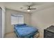 Cozy bedroom with a ceiling fan, and natural light at 8421 Cheerful Brook Ave, Las Vegas, NV 89143