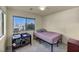 Well-lit bedroom with a large window and neutral decor at 8421 Cheerful Brook Ave, Las Vegas, NV 89143