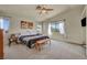 Spacious main bedroom featuring natural light and an ensuite bathroom entrance at 8421 Cheerful Brook Ave, Las Vegas, NV 89143