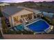 An aerial view showcasing a private backyard oasis with a pool and comfortable lounge area at 91 Alta Cascata Pl, Henderson, NV 89011