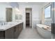 Bathroom featuring dual sinks and a soaking tub at 91 Alta Cascata Pl, Henderson, NV 89011