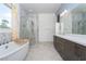 Spacious bathroom featuring a tub, shower, and dual vanity at 91 Alta Cascata Pl, Henderson, NV 89011
