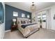 Comfortable bedroom with plush carpeting, stylish decor, and plenty of natural light at 91 Alta Cascata Pl, Henderson, NV 89011