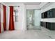Open bedroom with glass doors, cabinets, and tile floor at 91 Alta Cascata Pl, Henderson, NV 89011