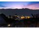 Striking city skyline view with mountain backdrop at dusk at 91 Alta Cascata Pl, Henderson, NV 89011