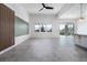 Bright, open-concept great room with tile flooring, modern lighting, and backyard access at 91 Alta Cascata Pl, Henderson, NV 89011
