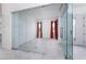 Spacious open room with glass doors, windows, and tile floor at 91 Alta Cascata Pl, Henderson, NV 89011