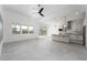 Bright living space boasts tile floors, kitchen, backyard access, and large windows at 91 Alta Cascata Pl, Henderson, NV 89011