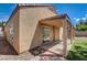 Rear exterior with sliding glass door to covered patio and low maintenance landscaping at 9530 Redstar St, Las Vegas, NV 89123