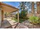 Private backyard with covered patio, low-maintenance landscaping and small patch of green grass at 9530 Redstar St, Las Vegas, NV 89123