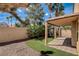 Backyard features covered patio, low-maintenance desert landscaping, and artificial turf at 9530 Redstar St, Las Vegas, NV 89123