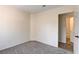 Inviting bedroom with soft carpeting, neutral walls, and a glimpse of the adjacent bathroom at 9530 Redstar St, Las Vegas, NV 89123