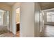 Hallway featuring tile flooring leading to a bedroom and a bathroom at 9530 Redstar St, Las Vegas, NV 89123