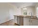 Kitchen island with stainless steel appliances, tile floors, and granite counters at 9530 Redstar St, Las Vegas, NV 89123