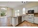Charming kitchen with stainless steel appliances, granite countertops, and tile flooring at 9530 Redstar St, Las Vegas, NV 89123