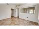 Expansive living room with tile floors, large wall mirror, and high ceilings, offering ample natural light at 9530 Redstar St, Las Vegas, NV 89123
