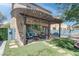 Backyard features a cozy outdoor seating area, a pergola, and custom pavers at 9844 Red Horse St, Las Vegas, NV 89143