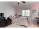 Charming bedroom with natural light, a ceiling fan, and stylish laminate floors at 9844 Red Horse St, Las Vegas, NV 89143