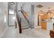 Bright entryway featuring stairs, light-colored floors, and an open view into the kitchen area at 9844 Red Horse St, Las Vegas, NV 89143