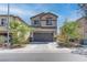 Charming home featuring a two-car garage, complemented by desert landscaping and a clear, sunny sky at 9844 Red Horse St, Las Vegas, NV 89143