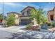Charming two-story home showcasing a well-maintained front yard and a two-car garage on a sunny day at 9844 Red Horse St, Las Vegas, NV 89143