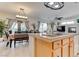 Kitchen view into the dining and living areas shows a breakfast bar with granite countertops at 9844 Red Horse St, Las Vegas, NV 89143
