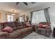 Cozy living space with comfortable seating, stylish decor, and lots of natural light with an adjacent dining area at 9844 Red Horse St, Las Vegas, NV 89143