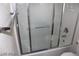 A view of the shower-tub with glass doors and chrome fixtures, perfect for relaxation at 10021 Via Toro Ave, Las Vegas, NV 89117