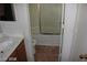 Bathroom showcases a shower-tub combo, toilet, and neutral tile at 10021 Via Toro Ave, Las Vegas, NV 89117