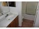 Bathroom showcases a shower-tub combo, toilet, and modern single sink at 10021 Via Toro Ave, Las Vegas, NV 89117