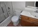 The functional bathroom includes a vanity with storage, a toilet, and a shower-tub combination at 10021 Via Toro Ave, Las Vegas, NV 89117