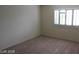 Sunlit bedroom features modern shuttered windows and fresh, neutral carpeting at 10021 Via Toro Ave, Las Vegas, NV 89117