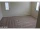 Neutral bedroom featuring lots of natural light and soft carpeting at 10021 Via Toro Ave, Las Vegas, NV 89117