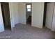 Well-lit room with plush carpeting and convenient access to the bathroom at 10021 Via Toro Ave, Las Vegas, NV 89117