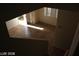 View of the living room showcases tiled flooring, open layout, and large windows at 10021 Via Toro Ave, Las Vegas, NV 89117