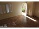 View of the bright living room showcases tiled flooring, open layout, and windows at 10021 Via Toro Ave, Las Vegas, NV 89117