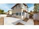Rear exterior view of the home showcasing a concrete patio and access to a side yard at 10245 Missouri Meadows St, Las Vegas, NV 89183